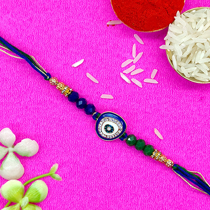 Evil eye protector rakhi with blue and green pearls