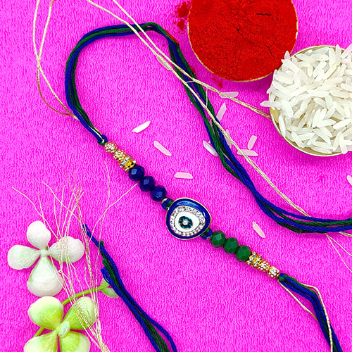 Evil eye protector rakhi with blue and green pearls