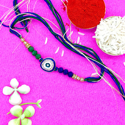 Evil eye protector rakhi with blue and green pearls