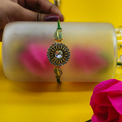 floral shape rakhi with Green and white Stone